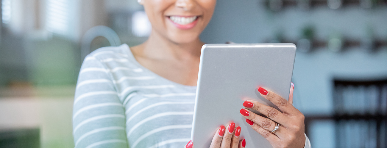 Woman using digital tablet to video chat with doctor for healthcare appointment